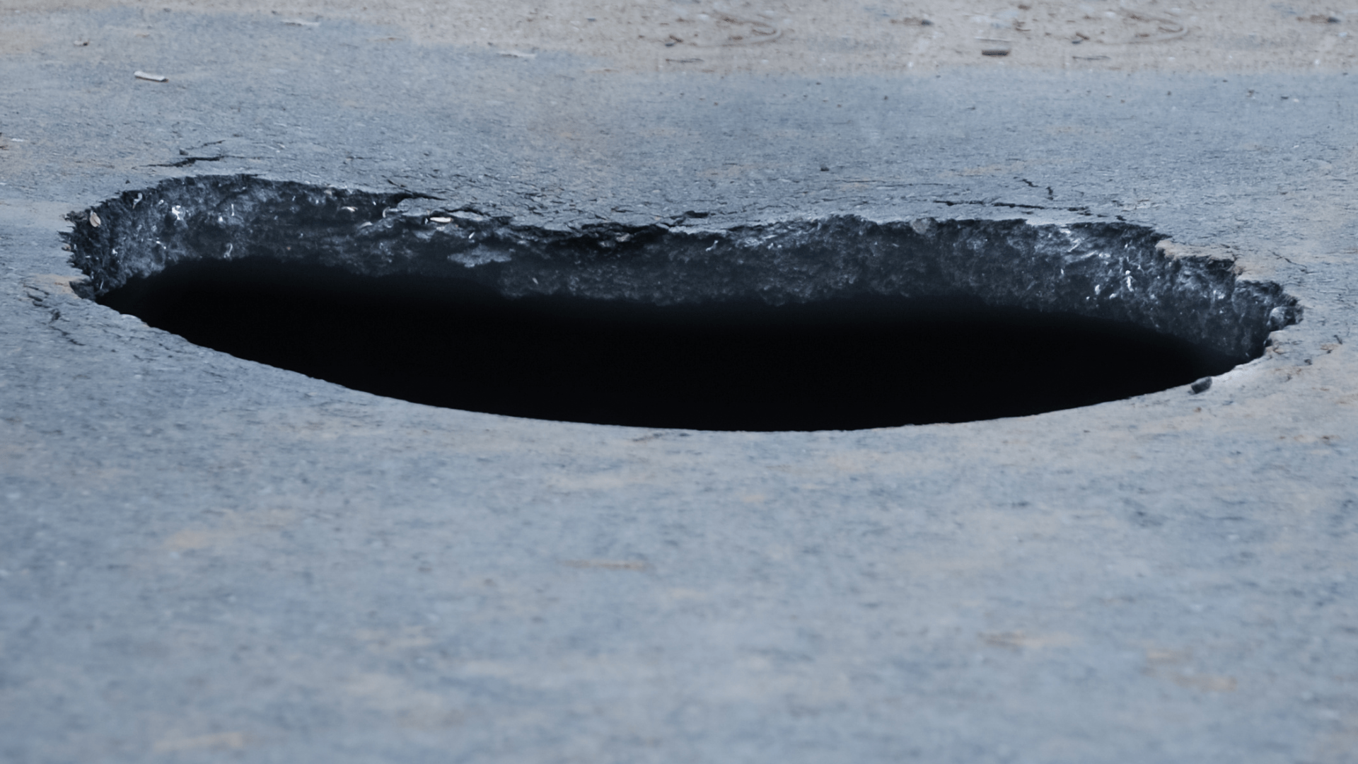 large concrete pothole
