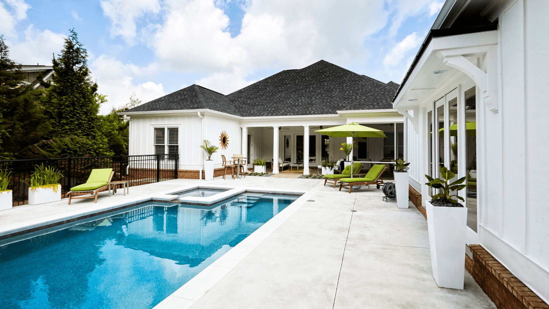 north carolina concrete pool deck with white house